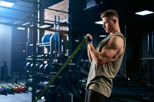 bodybuilder training arm with resistance band