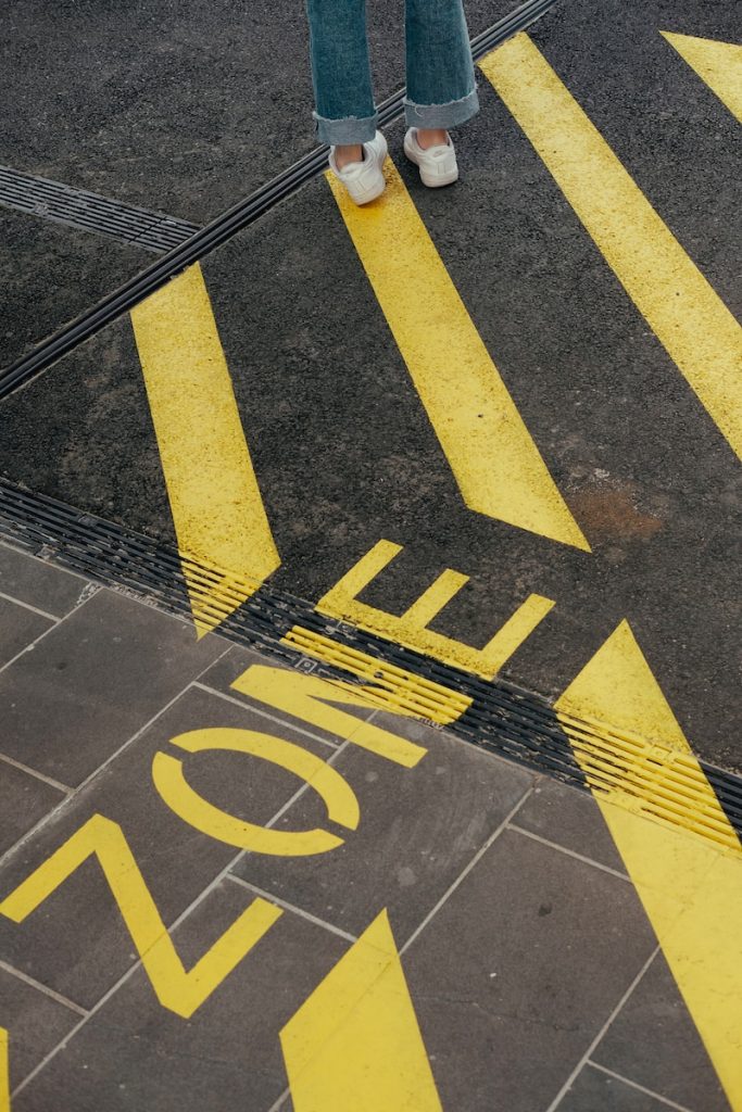 do deadlines ruin creativity? person standing on yellow stripe sign on orad