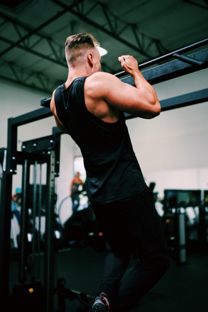 Get Your First Pull-up Or Chin-up! 30-Day Pull up Progression Plan man in black tank top and black pants
