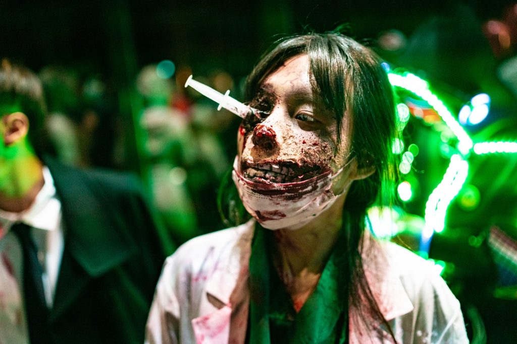 Zombie Apocalypse a woman with blood on her face and a cigarette in her mouth